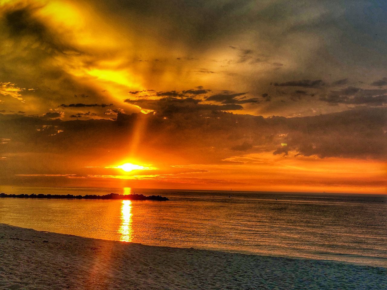 SCENIC VIEW OF SEA AGAINST ORANGE SKY DURING SUNSET