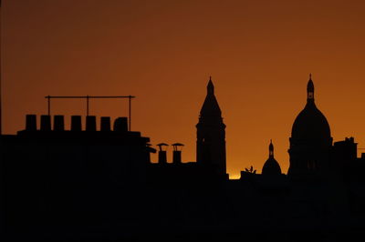 Silhouette of temple against sky during sunset montmartre paris 