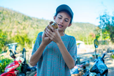 Friendship, girl and mammal, beautiful white girl holding guinea pig, cute relationship