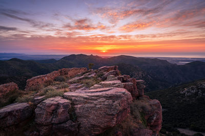 Sunrise in the mediterranean sea. ruined castro castle in spain.