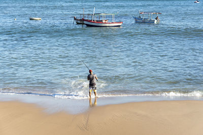 Rear view of man on beach