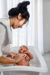 Mother and son in bathroom