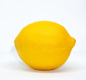 Close-up of orange slice against white background