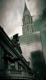 Low angle view of building against cloudy sky