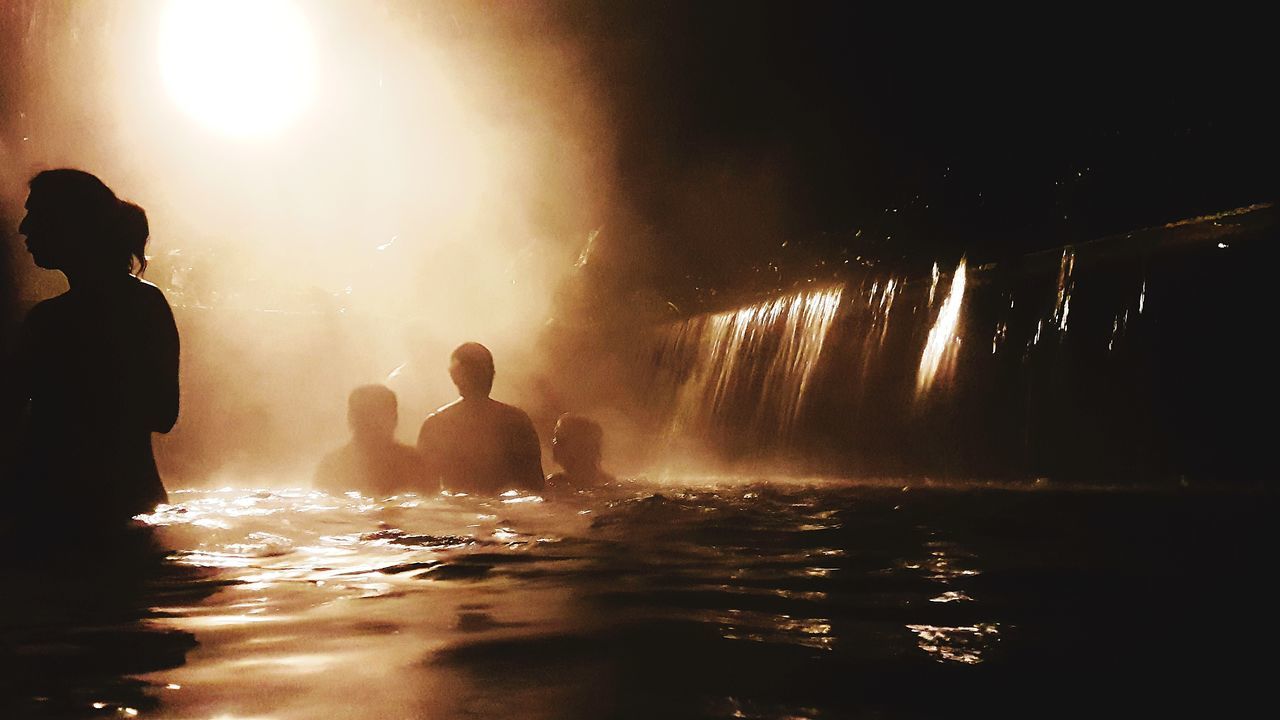 PEOPLE ENJOYING IN SWIMMING POOL