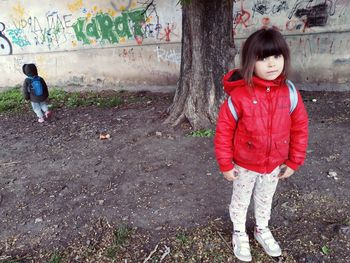 Full length of girl standing outdoors