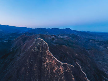 Aerial view of landscape with mountain range in background