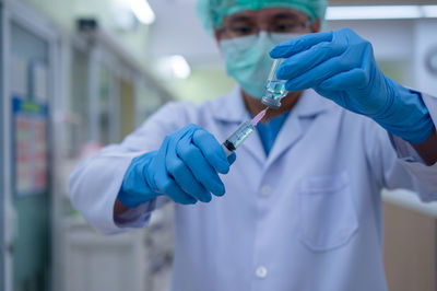 Midsection of person working in costume