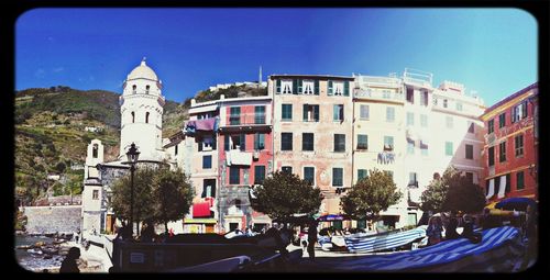 Buildings against blue sky and clouds