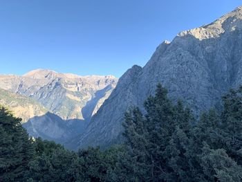 View of mountain range against blue sky