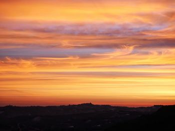 Scenic view of dramatic sky during sunset