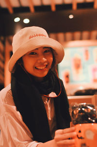 Portrait of smiling woman shopping in store