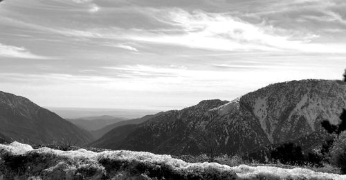 Scenic view from road of land and mountains against sky. fine art photography.