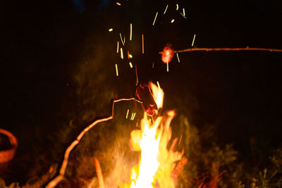 Close-up of fire burning at night