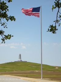 Low angle view of flag against sky