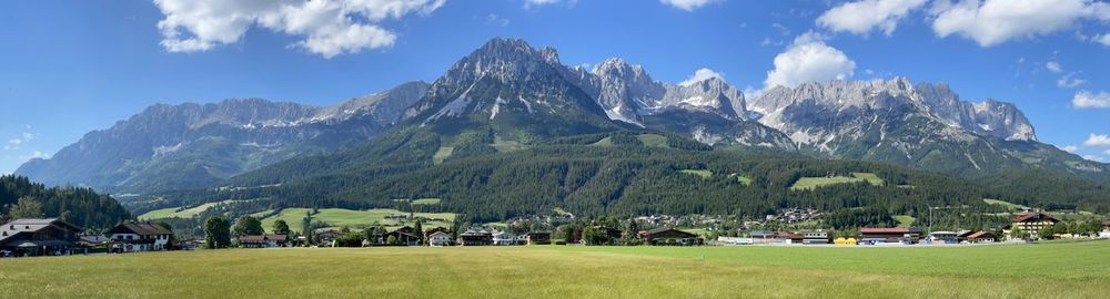 Panoramic shot of building and mountains against sky