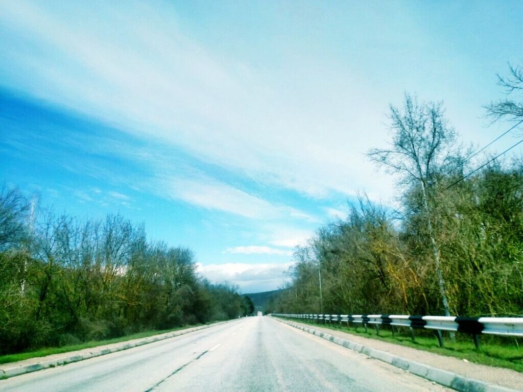 transportation, the way forward, road, tree, diminishing perspective, road marking, vanishing point, sky, country road, blue, car, empty road, street, cloud - sky, long, asphalt, cloud, empty, nature, highway