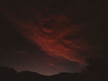 Silhouette of mountain against sky at sunset