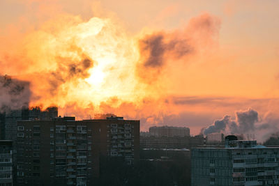 Buildings against sky during sunset