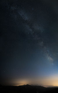 Scenic view of star field against sky at night