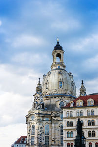 Low angle view of cathedral against cloudy sky