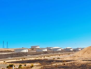 Residential district against clear blue sky