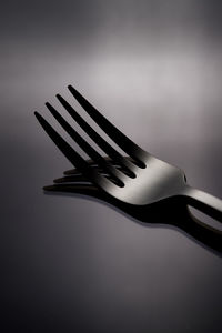 Close-up of fork on black background