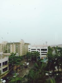 Wet city against clear sky