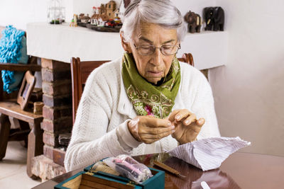 Woman sitting on table