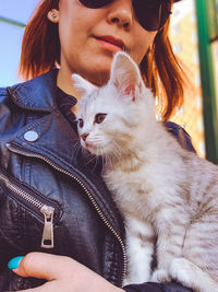 Midsection of woman with cat