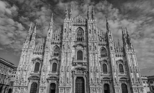 Low angle view of cathedral against cloudy sky