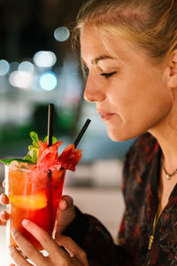 Close-up of woman holding drink