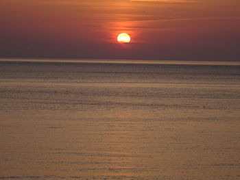 Scenic view of sea against sky at sunset