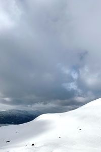 Scenic view of snow covered mountains against sky