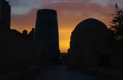 Silhouette of city at sunset