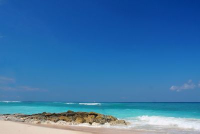 Scenic view of sea against blue sky