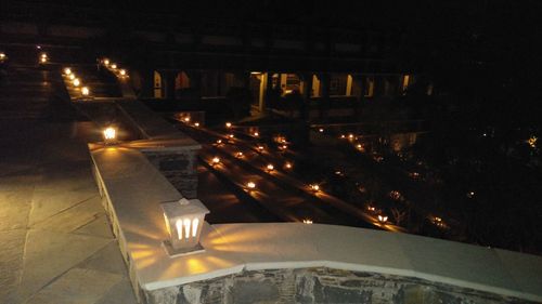 High angle view of illuminated street at night