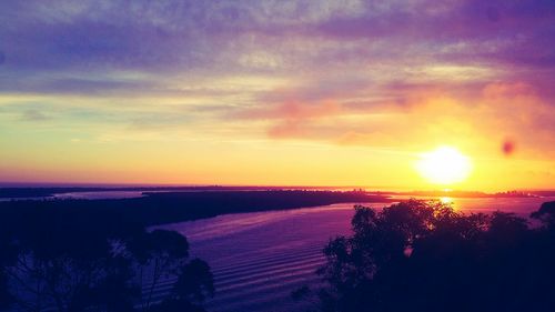 Scenic view of silhouette landscape against sky during sunset