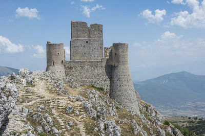 The ancient castle of rocca calascio  with the beautiful mountains  of abruzzo in the background