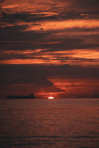 Scenic view of sea against orange sky during sunset