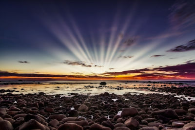 Scenic view of sea against sky during sunrise