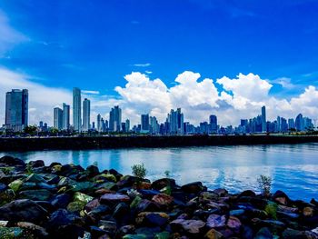 Cityscape against cloudy sky