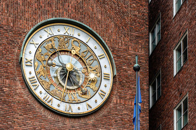 The astronomical clock of oslo city hall. it houses the city council