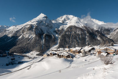 Scenic view of snowcapped mountains against sky