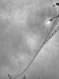 Low angle view of street light against sky