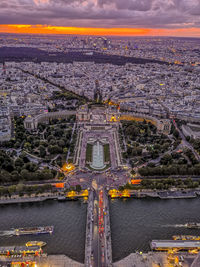 Aerial view of esplanade du trocadero against cloudy sky during sunset