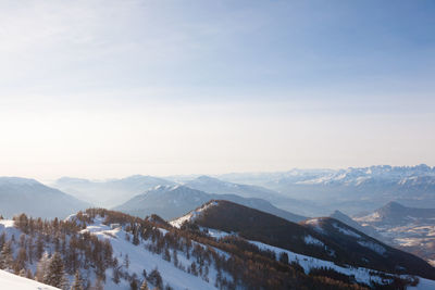 Scenic view of snowcapped mountains against sky