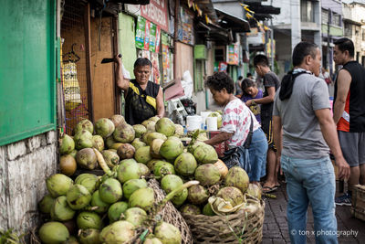 People at market stall