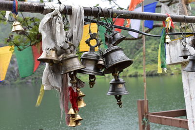 Close-up of clothes hanging in row