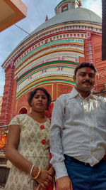 Portrait of couple standing outdoors